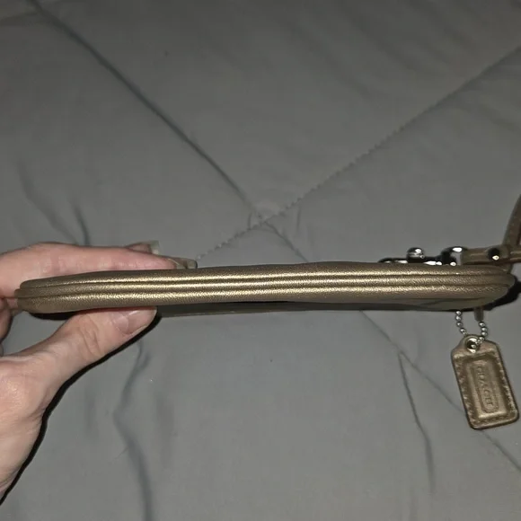 Coach metallic bronze wristlet featuring a detachable strap and a embossed logo - Picture 6 of 7